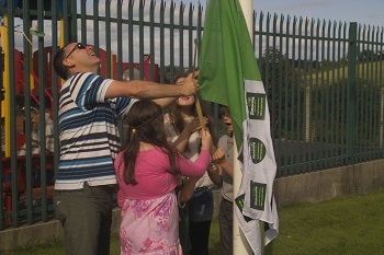 Gathering flag being raised on the first day