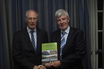 Paddy Lawlor presenting Cathal Flood Editor with a copy of the book